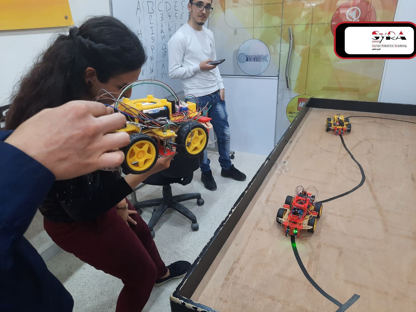 Arduino robot cars on a line-following track