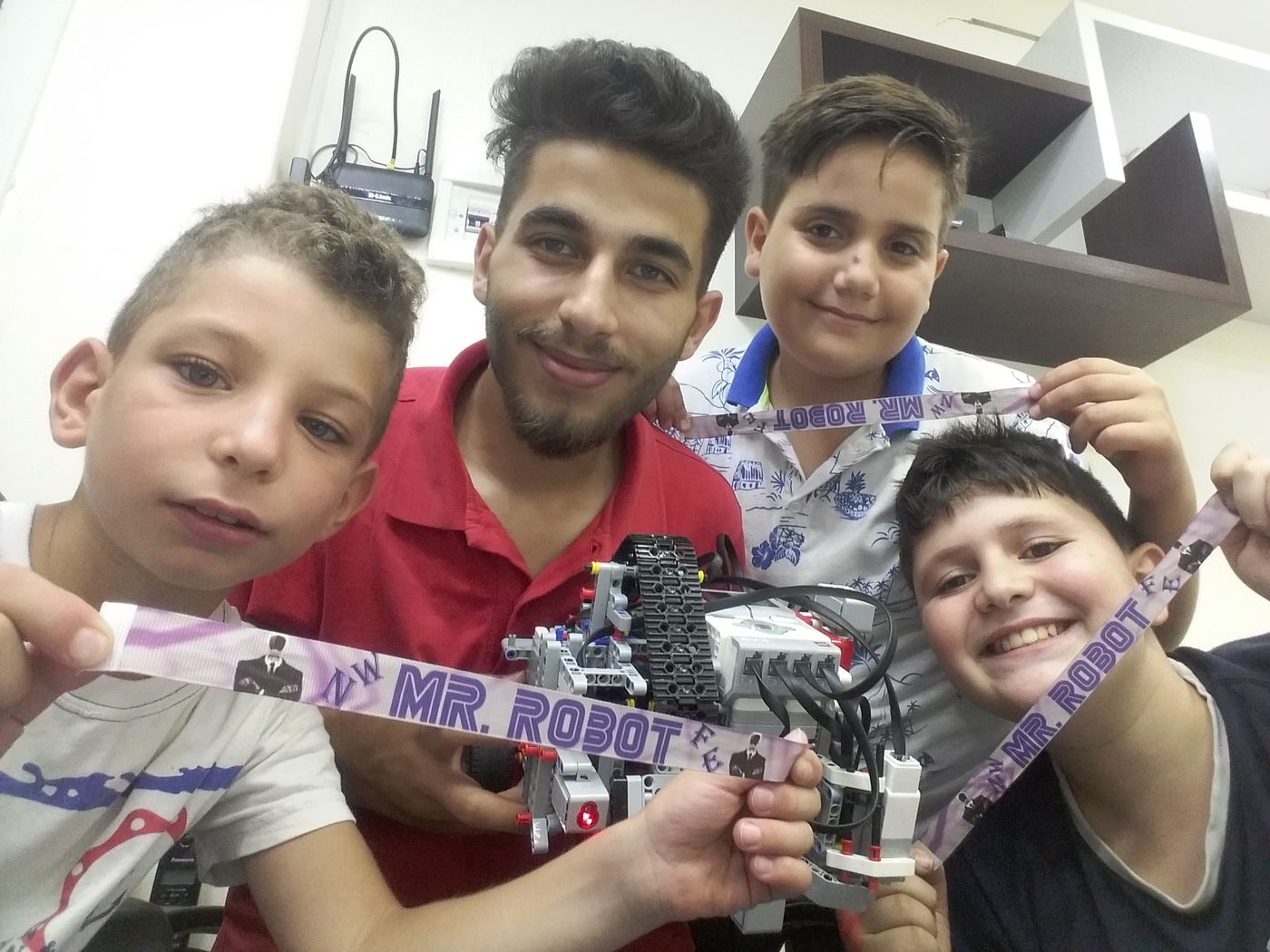 Students showing their robot after a build session