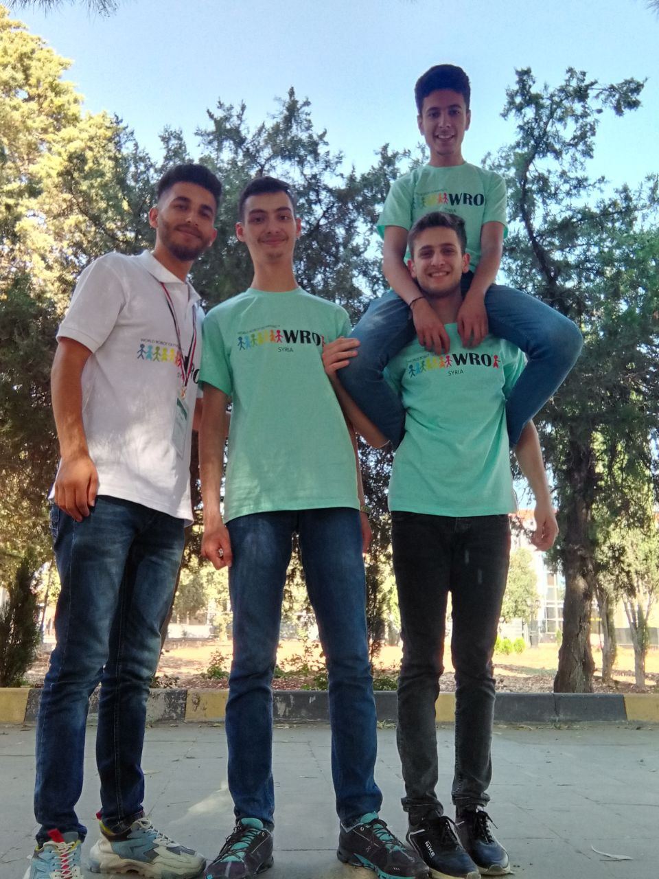 Ward with team members in WRO Syria shirts